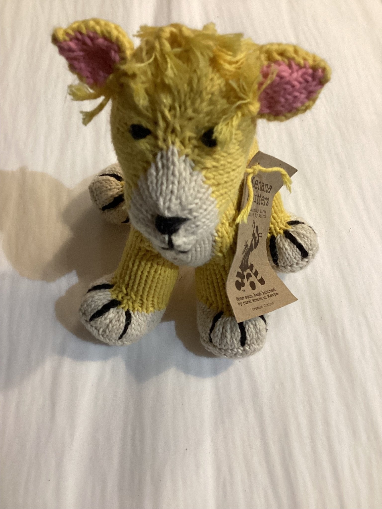 Buy Kenana Knitters - Rascal Baby Lion - Yellow by Kenana Knitters - at Hamish + Grace