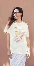 Buy Feather and Noise - Vacay Graphic Tee Butter by Feather & Noise - at Hamish & Grace