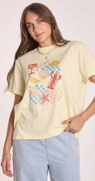 Buy Feather and Noise - Vacay Graphic Tee Butter by Feather & Noise - at Hamish & Grace