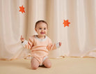 Buy Halcyon Nights - Cosy Peach Organic Long Sleeve Bodysuit by Halcyon Nights - at Hamish & Grace