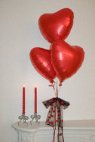 Buy Silver Coated Brass Bow Candle Holder by Love Ally - at Hamish + Grace