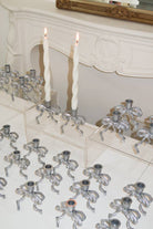 Buy Silver Coated Brass Bow Candle Holder by Love Ally - at Hamish + Grace